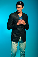 Obraz na płótnie Canvas Handsome asian man in suit. Summer fashion. Studio shot.