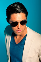 Obraz premium Asian man wearing suit and sunglasses. Summer fashion. Studio.