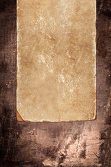 Faded old paper on a dark wooden background