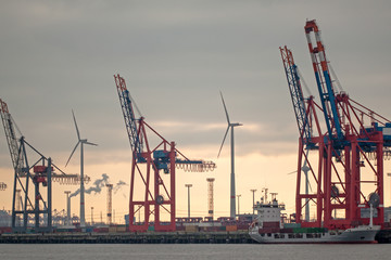 Hamburg harbour and wind power  on sunset