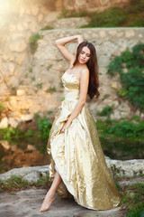 A girl in a colorful dress and the ruins of ancient Chersonese