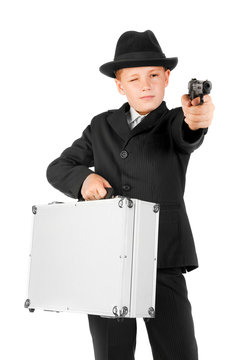 young guy gangster with a case and a gun