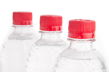 Plastic bottles of drinking water isolated