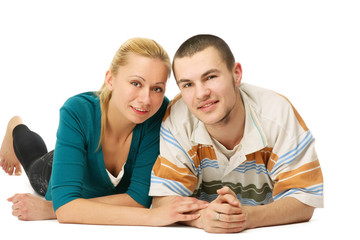 A young loving couple lying on the floor