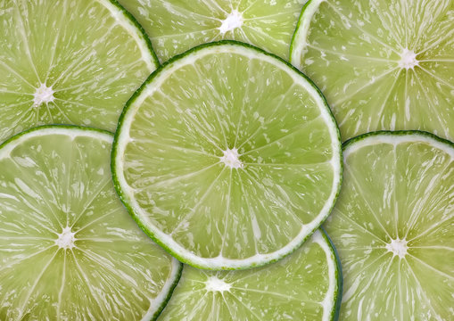 Food background - Sliced lime, isolated over white