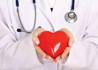 Positive female doctor standing with stethoscope