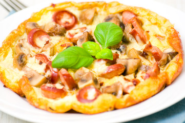 omelet with mushrooms, sausage  and cheese