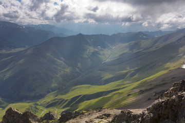 green mountain valley in a rays of sun