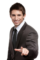 Portrait of smiling man pointing at you, isolated on white