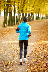 Fototapeta premium Female jogger in the park