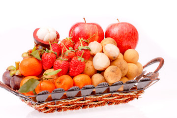 a group of variety fruit in basket on white