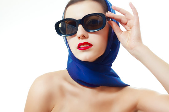 woman in glasses and headscarf