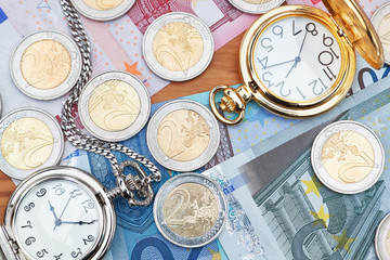 Pocket watches and euro money.