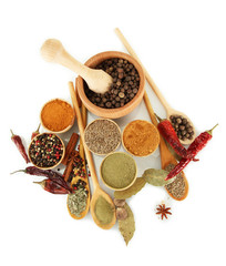 wooden mortar, bowls and spoons with spices isolated on white