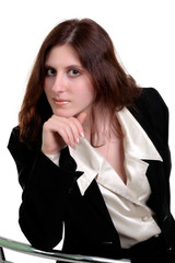 Beautiful young woman posing in business suit