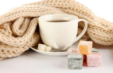 cup of tea with scarf isolated on white