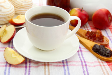 light breakfast with tea and homemade jam, on tablecloth