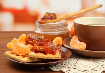light breakfast with tea and homemade jam, on wooden table