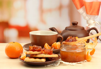 light breakfast with tea and homemade jam, on wooden table