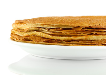 Sweet pancakes on plate isolated on white