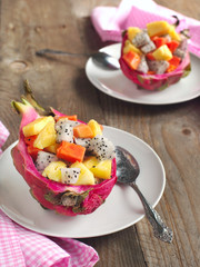 Fresh fruit salad in dragon fruit skin