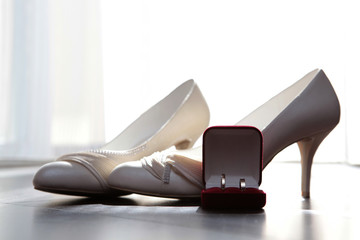 wedding rings on shoes of the bride