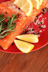 Fresh salmon fillet with herbals and lemon slices