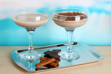 Cream cocktails on brightblue background