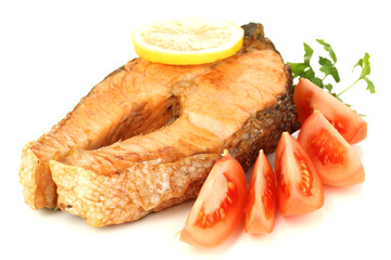 Appetizing grilled salmon with lemon and vegetables isolated