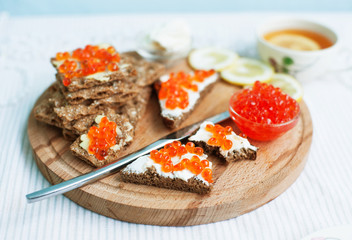 red caviar and tea with lemon for breakfast