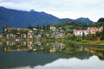 Fototapeta na wymiar Sapa cityscape with reflection on the lake in Vietnam