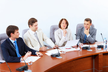 Obraz premium Four businesspeople at meeting