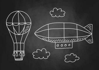 Fototapeta premium Hot air balloon and airship on blackboard