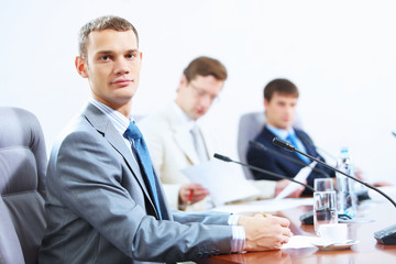 Three businesspeople at meeting