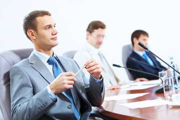 Three businesspeople at meeting