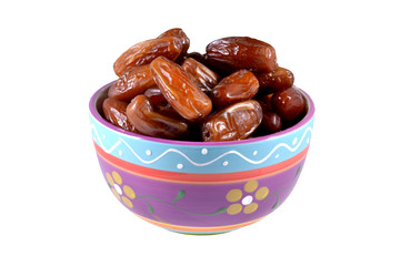 Dish with dried dates on a white background.