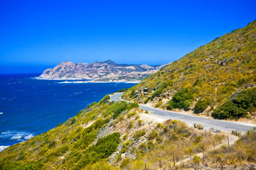 Crystal clean sea along white sand beach in island Corsica