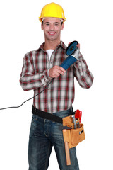 Tradesman holding an angle grinder
