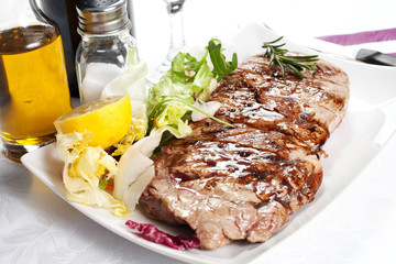 bovine meat cooked on the griddle