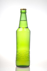Beer in green bottle isolated on white