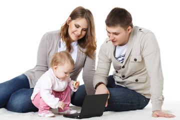 Happy family with laptop.