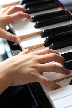 a kid playing piano