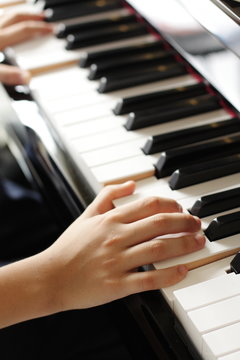 a kid playing piano