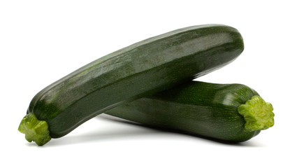 Two fresh vegetable zucchini isolated on white background