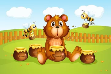  Een beer en bijen binnen een hek © GraphicsRF