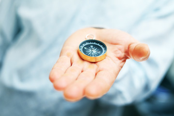 Image of compass in businessman hand