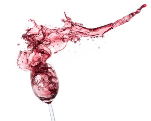 red wine splashing out of a glass, isolated on white