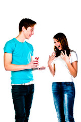 man gives a young and beautiful woman a gift