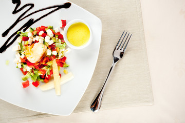 delicious salad on dish with fork