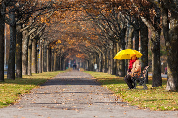 woman in the park with umbrella